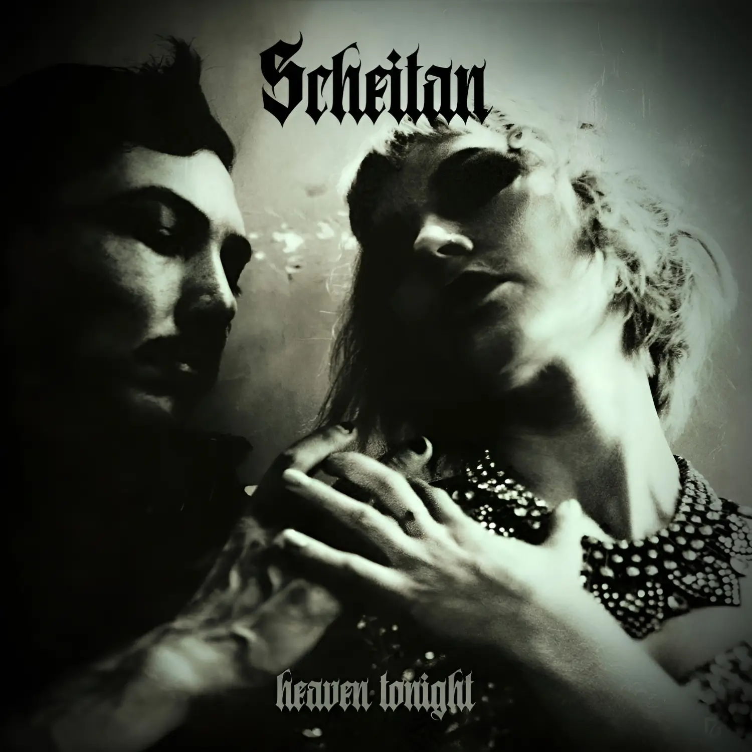 Black-and-white cover of Scheitan’s ‘Heaven Tonight’, showing a man and woman in a shadowy, intimate pose with gothic text.
