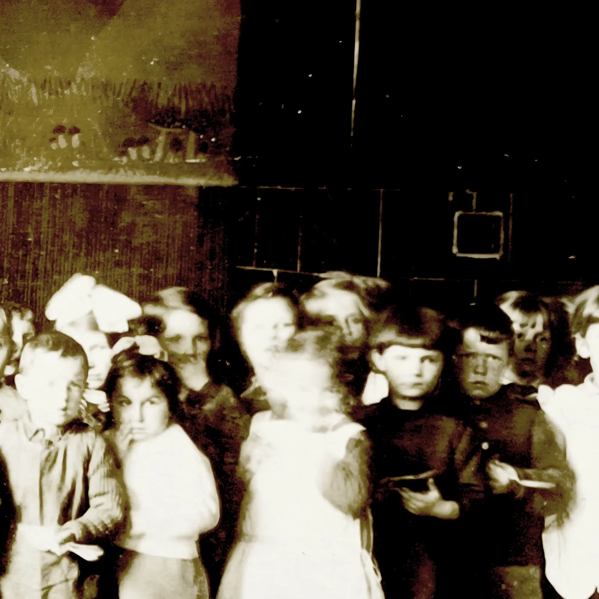 Distorted vintage photograph of children in a dimly lit classroom, used as artwork for CBZK’s single ‘Duchota’.