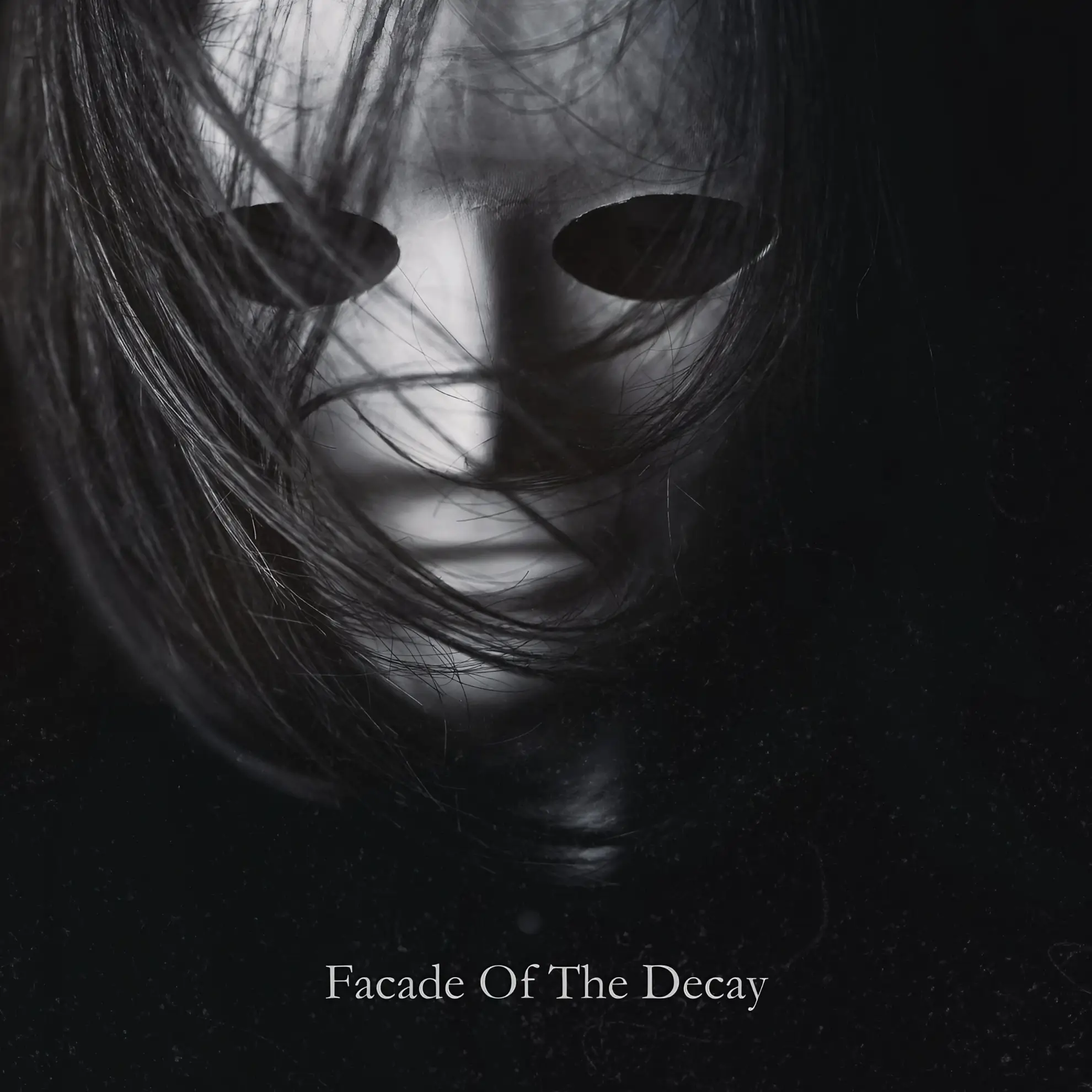 Cover art for ‘Facade Of The Decay’ featuring a white mask with dark eye holes obscured by strands of black hair.