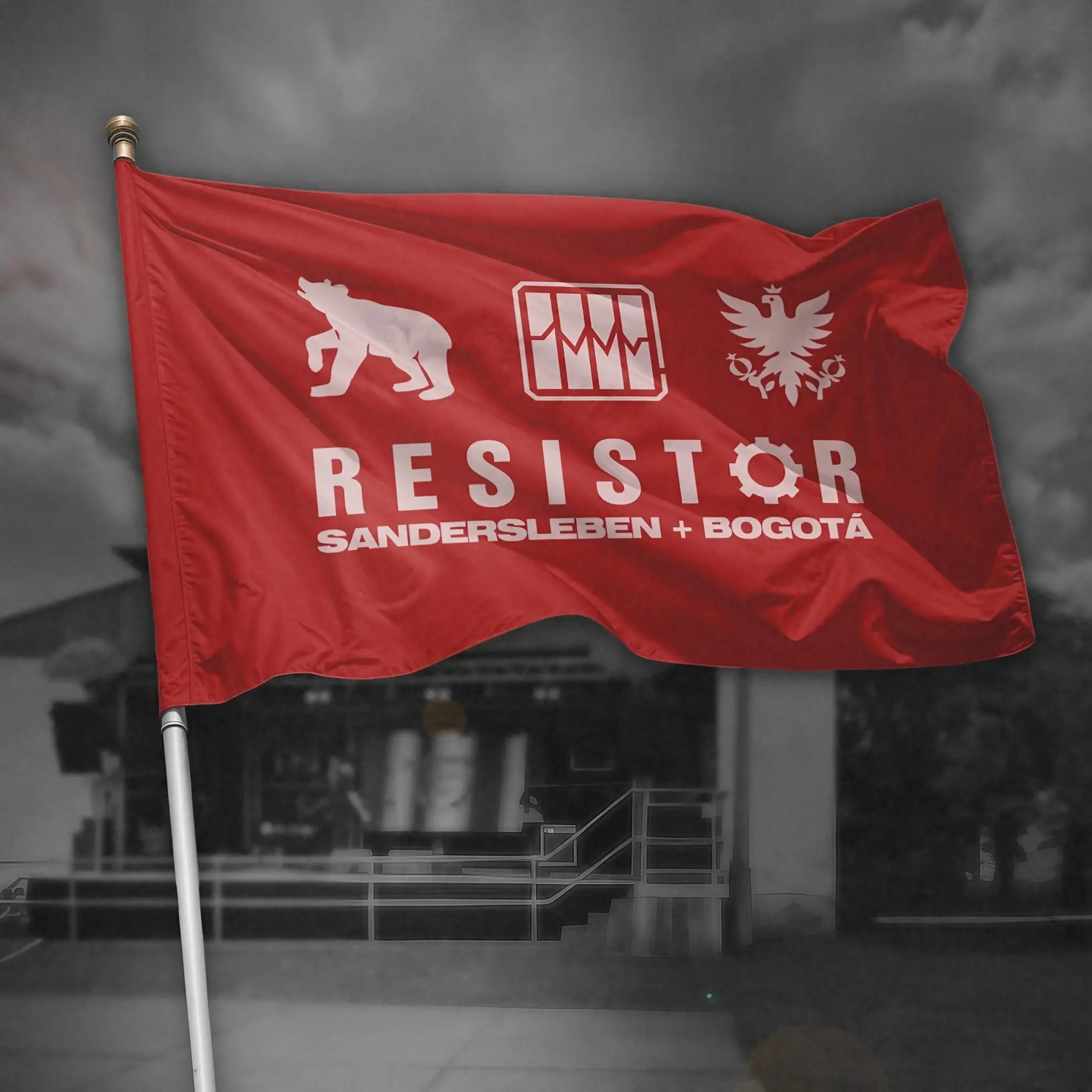 Red flag with white bear, gear, and eagle symbols, featuring Resistor logo and the text ‘Sandersleben + Bogotá.’
