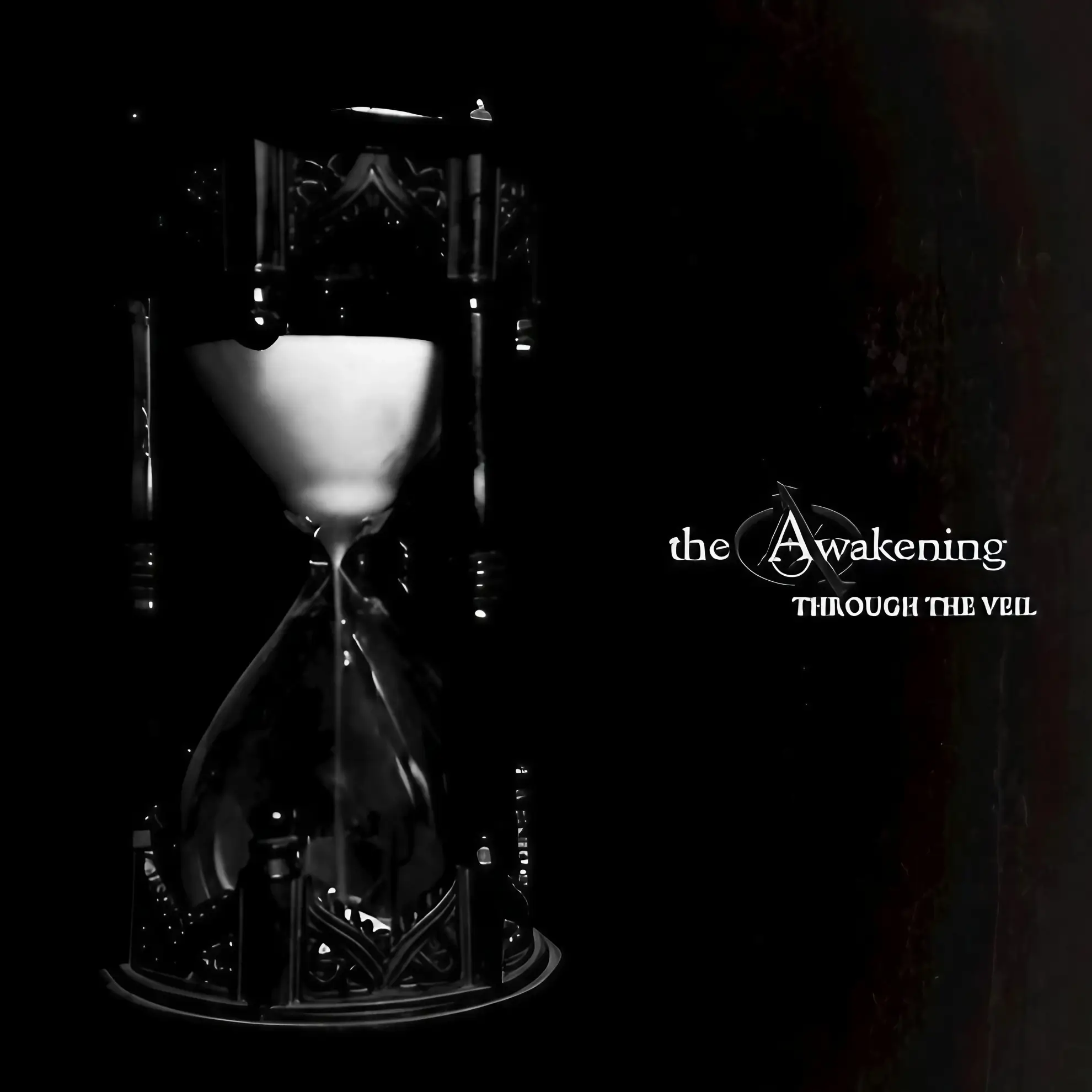 Gothic-style hourglass on a black background with the text “The Awakening – Through The Veil” in white.