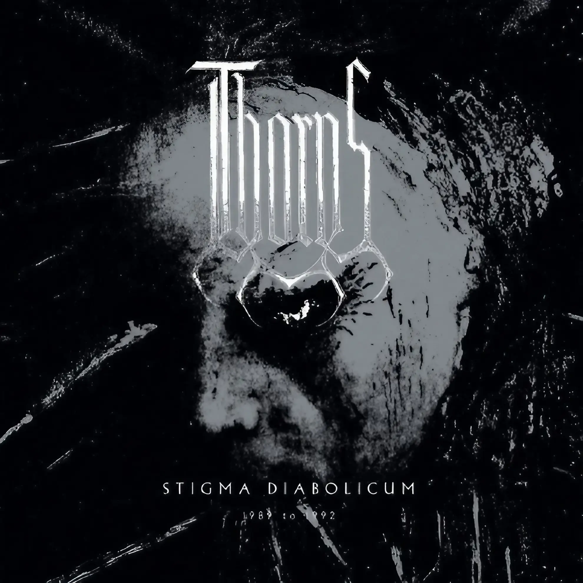 A distorted, high-contrast black and white face, overlaid with the metallic Thorns logo. The title ‘Stigma Diabolicum’ appears below.