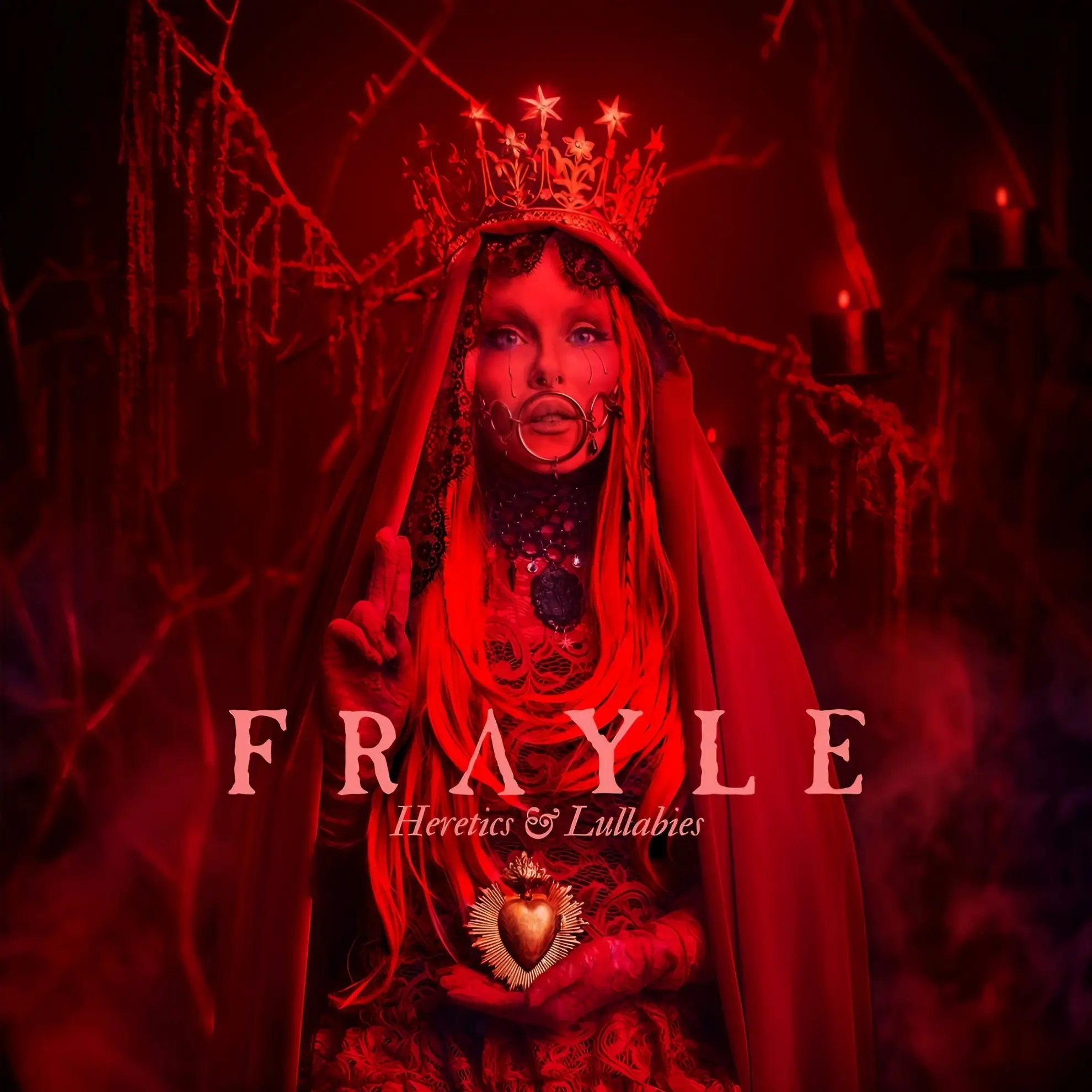 Red artwork for Frayle’s album ‘Heretics & Lullabies,’ featuring a crowned figure in a veil holding a heart emblem.