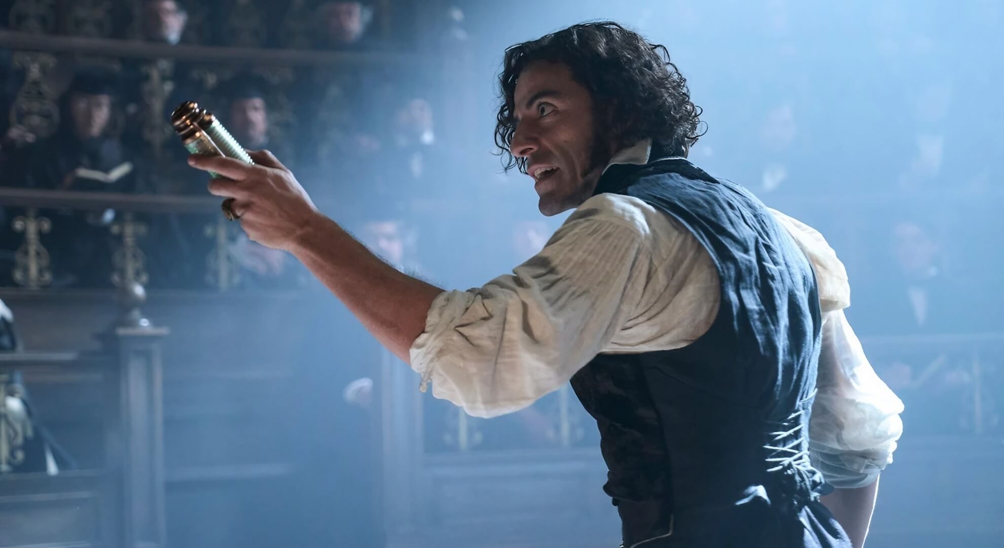Oscar Isaac as Victor Frankenstein, speaking passionately to an audience.