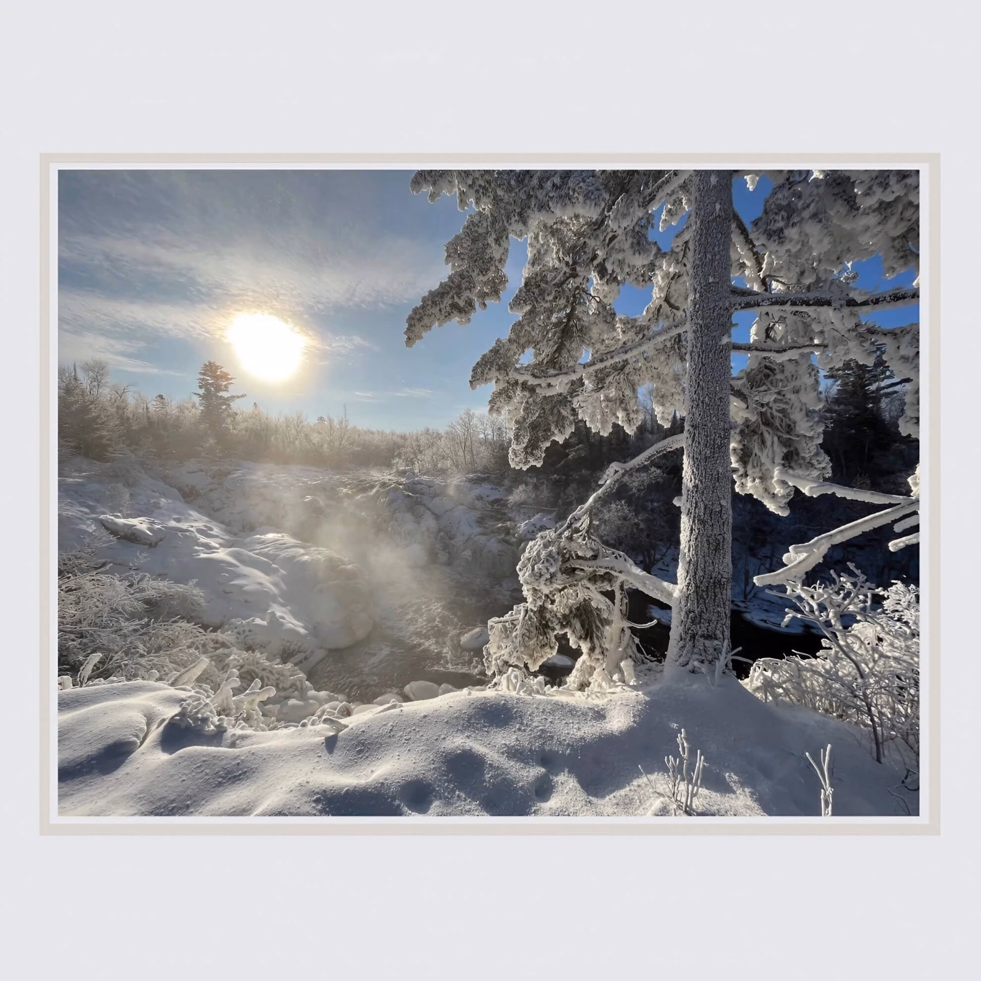 The &lsquo;Laurentian Blue&rsquo; album cover shows a bright sun over a snowy, misty river landscape, with a frost-covered pine tree in the foreground.