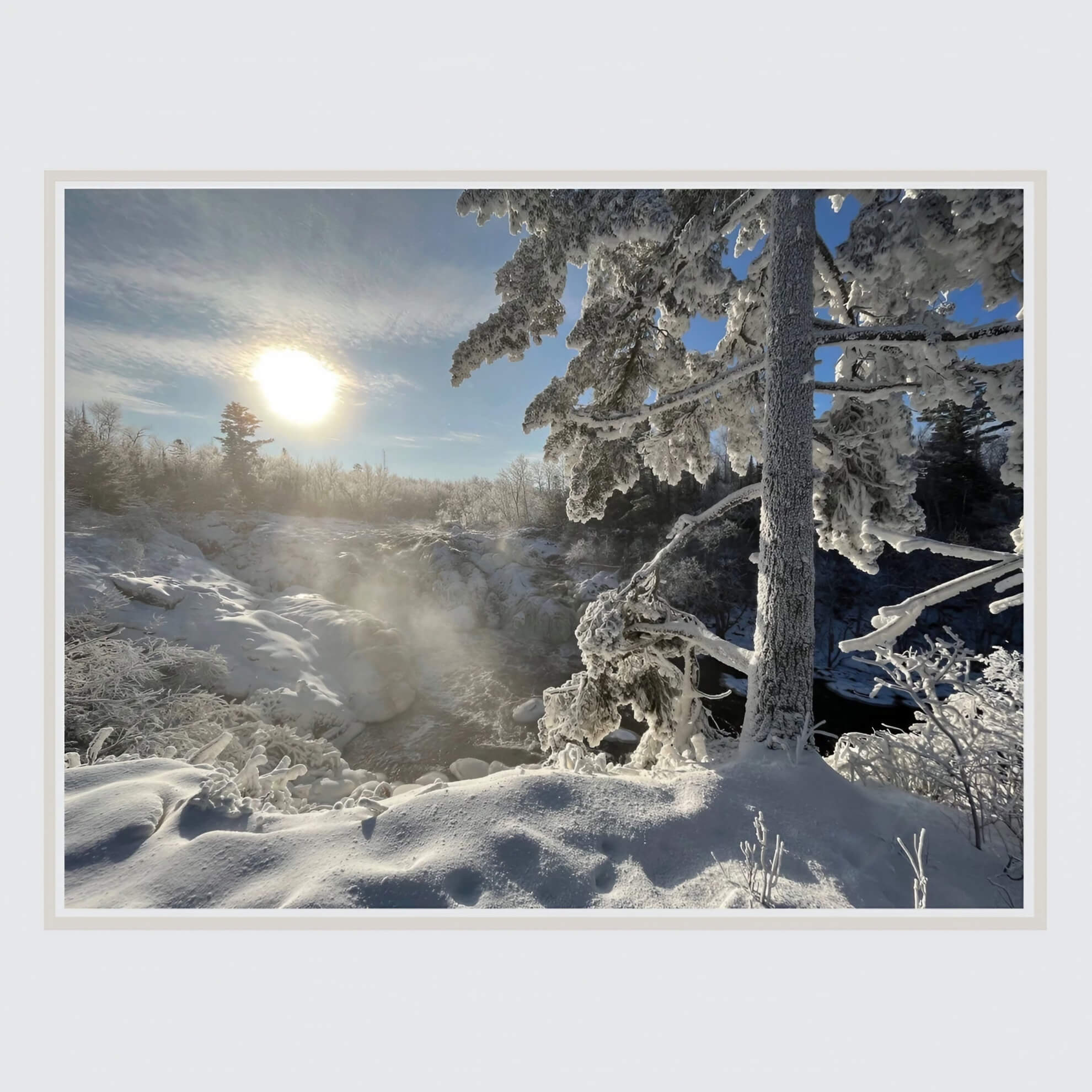 The ‘Laurentian Blue’ album cover shows a bright sun over a snowy, misty river landscape, with a frost-covered pine tree in the foreground.
