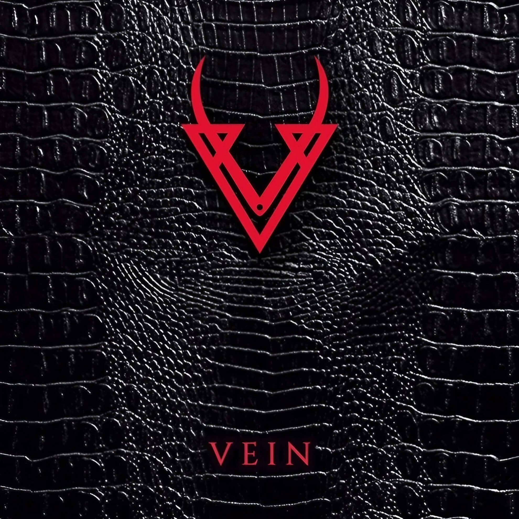 Album cover for ‘Chapter I.’ A red, horned “V” logo sits centered on a black, reptilian-skin-textured background.