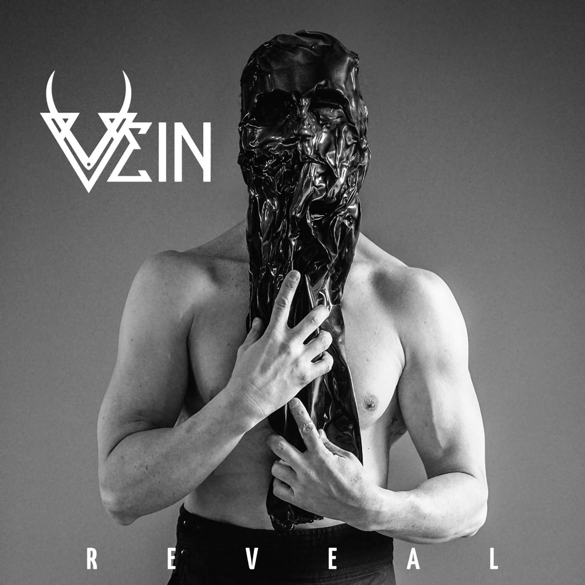 Album cover for ‘Reveal.’ A shirtless figure holds a black, melting mask obscuring their face. Black and white photo.