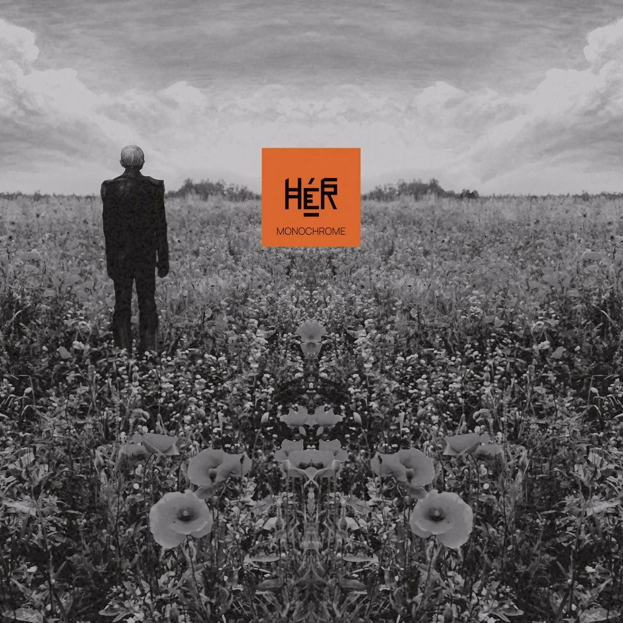 HÉR: Evoking a Powerful Ritual of Presence on Their Debut ‘Monochrome’ Album cover for ‘Monochrome.’ A figure stands in a black and white field. A central orange box holds the title text.