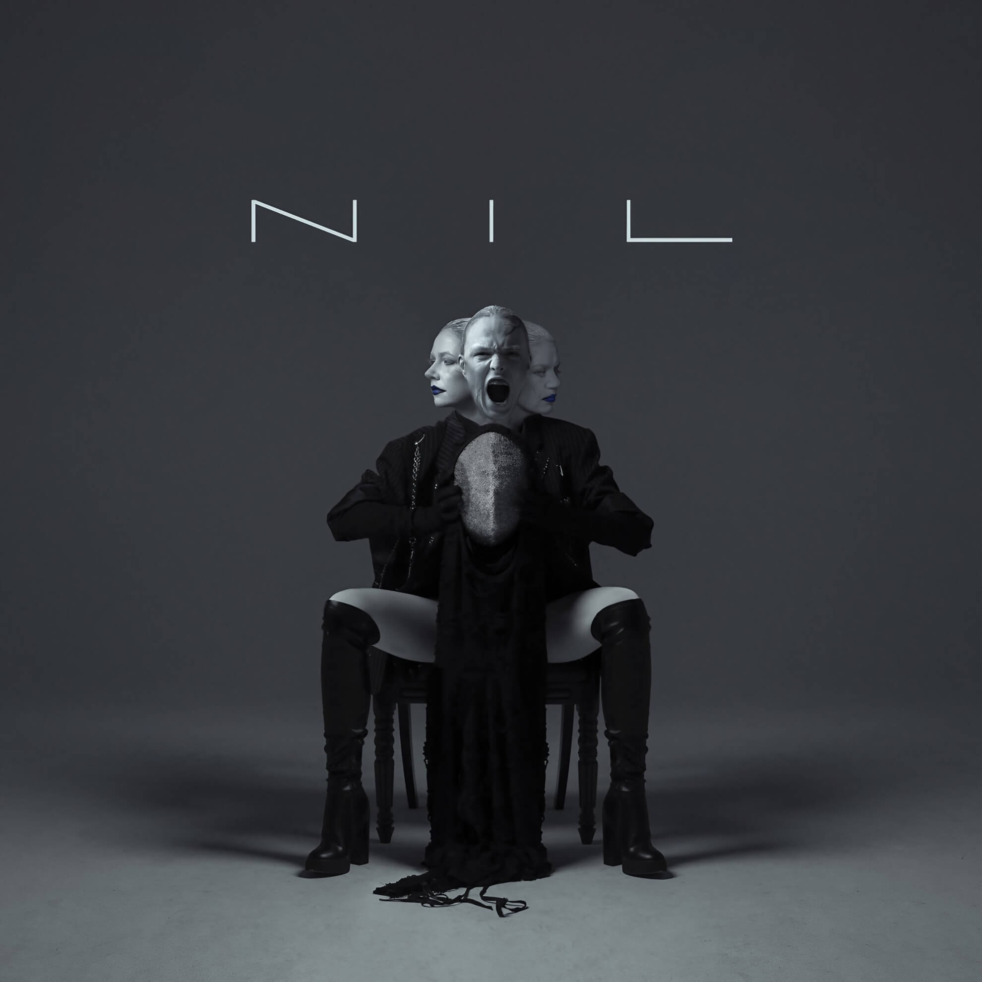 A seated figure with three faces—two stoic, one screaming—holds a mesh mask beneath the stylized text ‘NIL.’