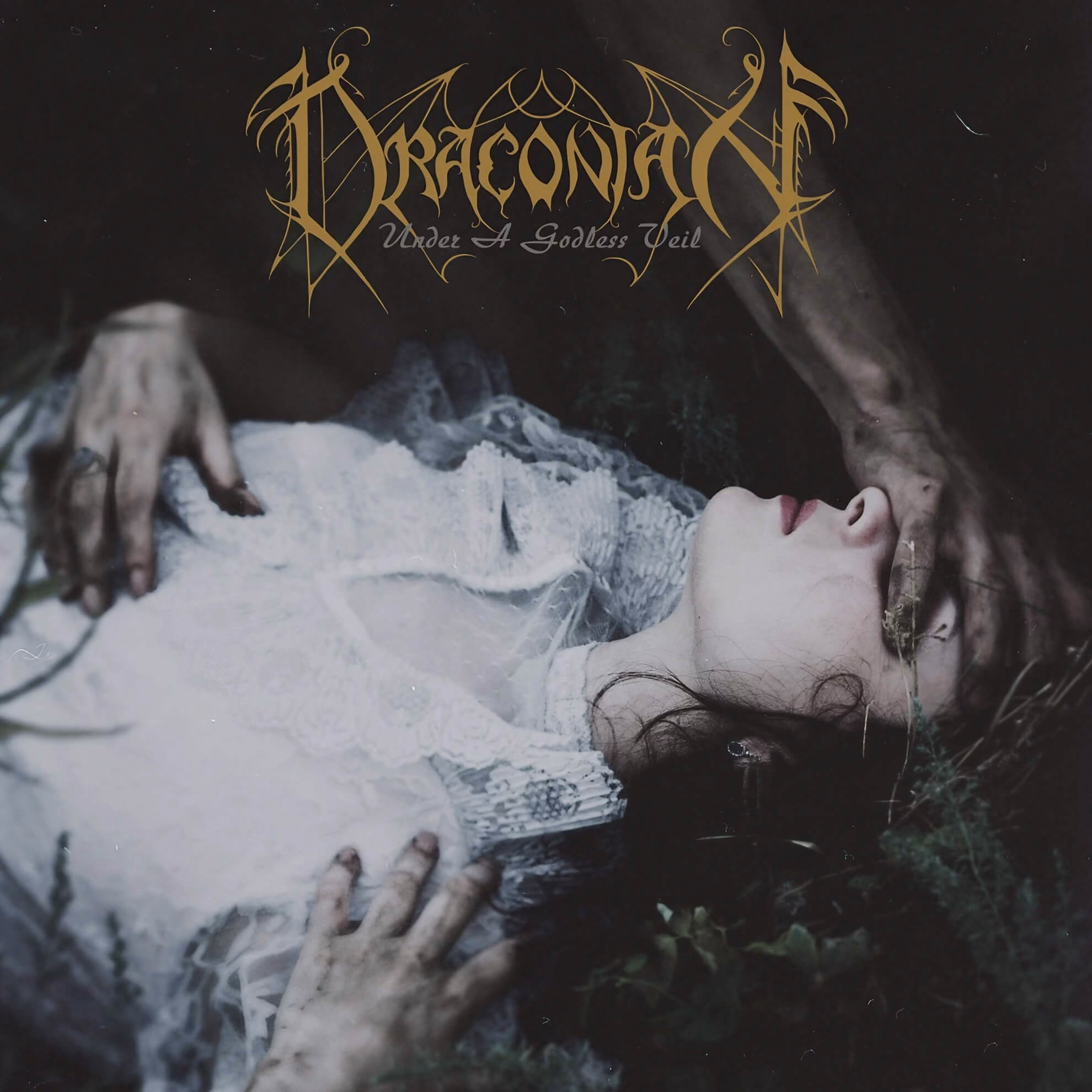 Album cover for &lsquo;Under a Godless Veil.&rsquo; A pale woman lies in darkness, a hand obscuring her eyes, beneath the gold band logo.