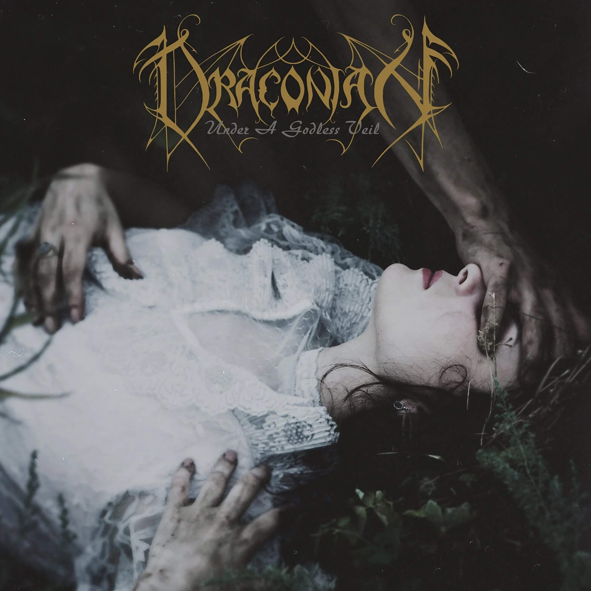 Album cover for ‘Under a Godless Veil.’ A pale woman lies in darkness, a hand obscuring her eyes, beneath the gold band logo.