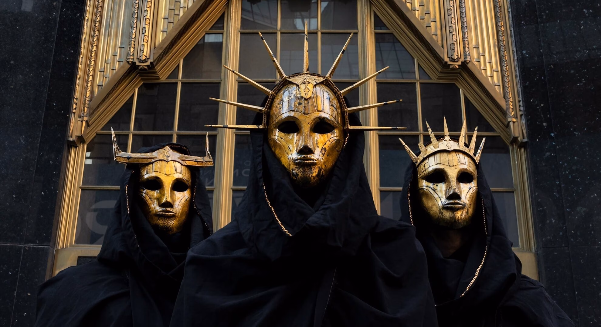 Cynic: A Convergence of Astral and Brutalist Sound at Capital Live Music, Bogotá in January Imperial Triumphant pose in golden Art Deco masks and black robes against an industrial, urban backdrop.