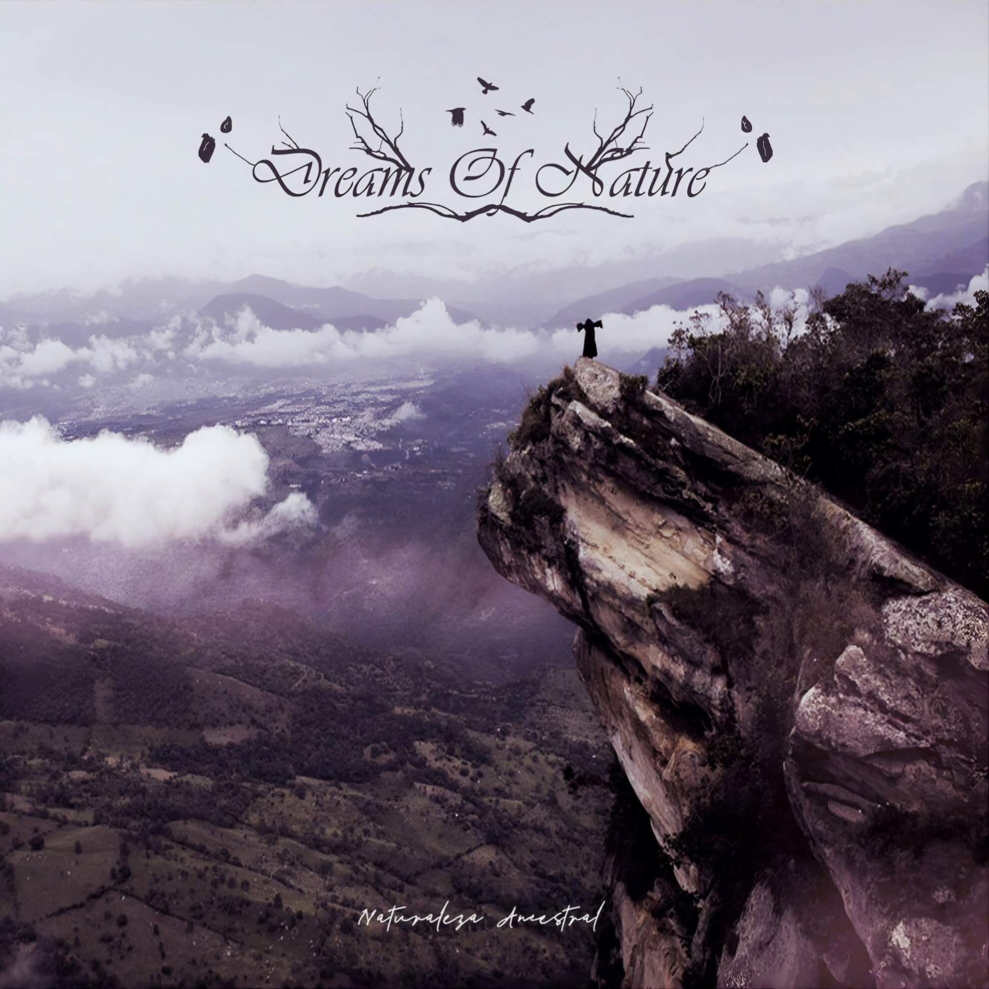 A solitary figure in a dark robe stands at the edge of a sheer rock outcrop at the summit of the Cerro de Quinini, Cundinamarca, Colombia, looking out over a vast Andean valley below.