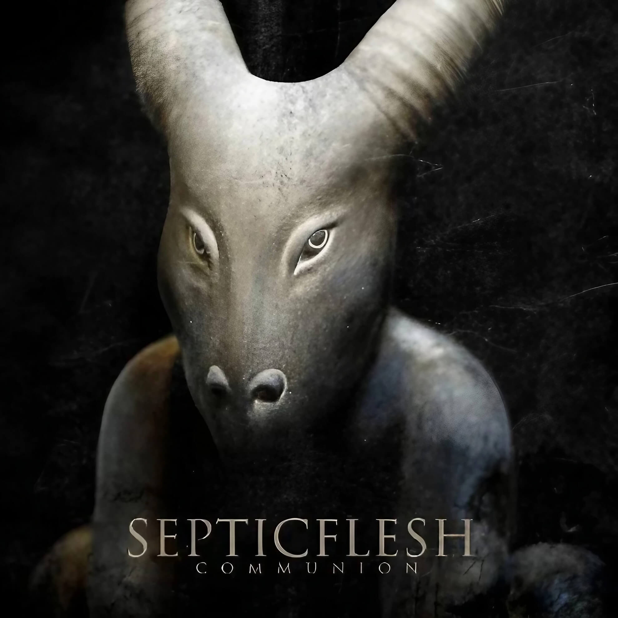 Seth Siro Anton &lsquo;Communion&rsquo; cover &mdash; sculpted bull-headed figure, forward-facing eyes, stone grey against deep black.