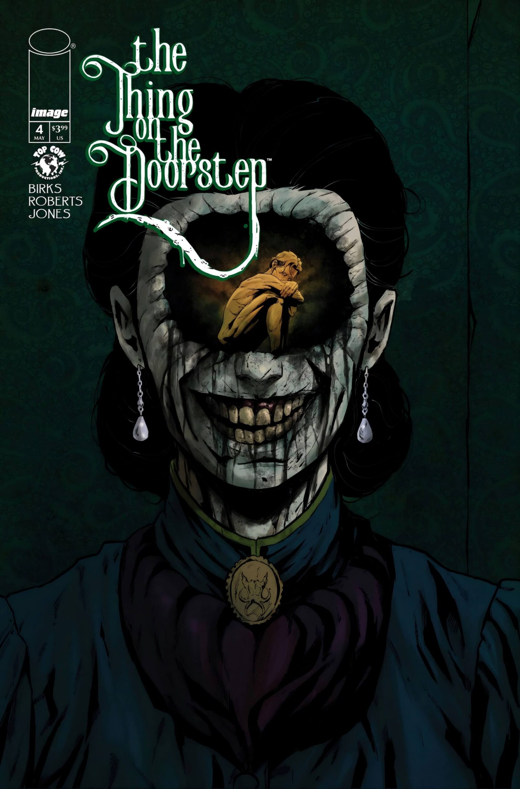 ‘The Thing on the Doorstep’ Puts Body Horror on the Page A grinning decayed woman's face close-up; where one eye should be, a small amber-lit figure huddles trapped inside the hollow socket.