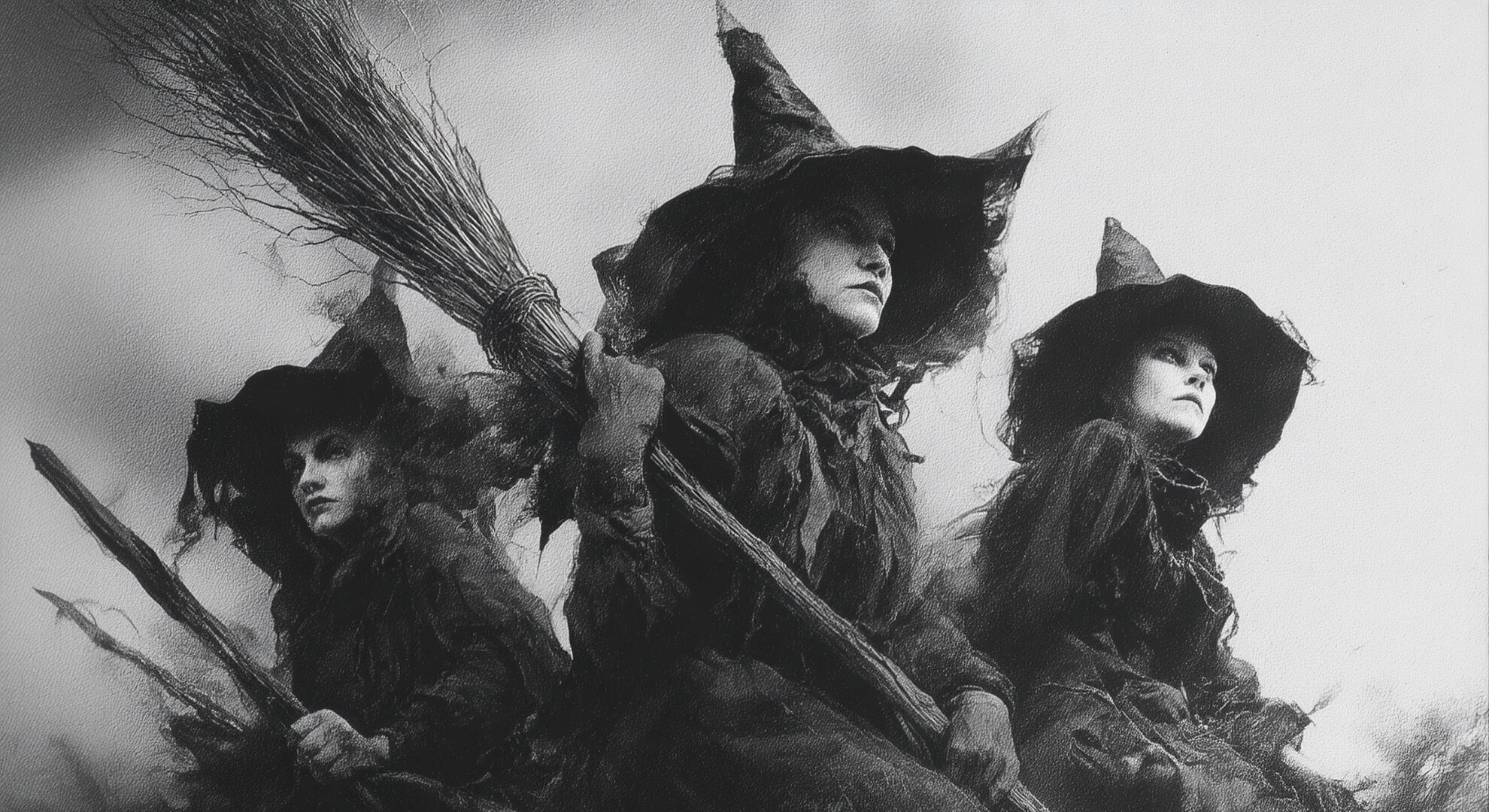 When the Witches Came to Bogotá and the Church Thundered Three women in witch costumes with pointed hats and broomsticks, gazing upward.