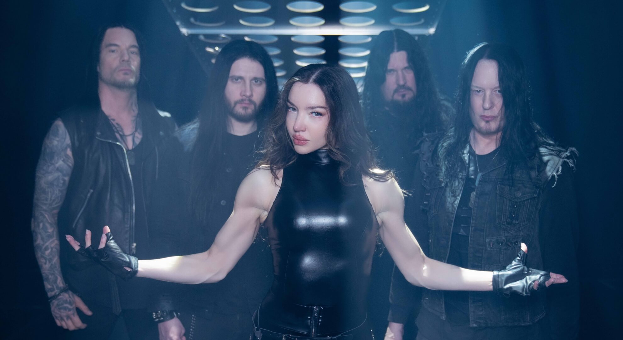 Arch Enemy’s Answer to Every Rights Challenge Is Escalation Arch Enemy with new vocalist Lauren Hart at center, arms extended, flanked by the band’s four current members.