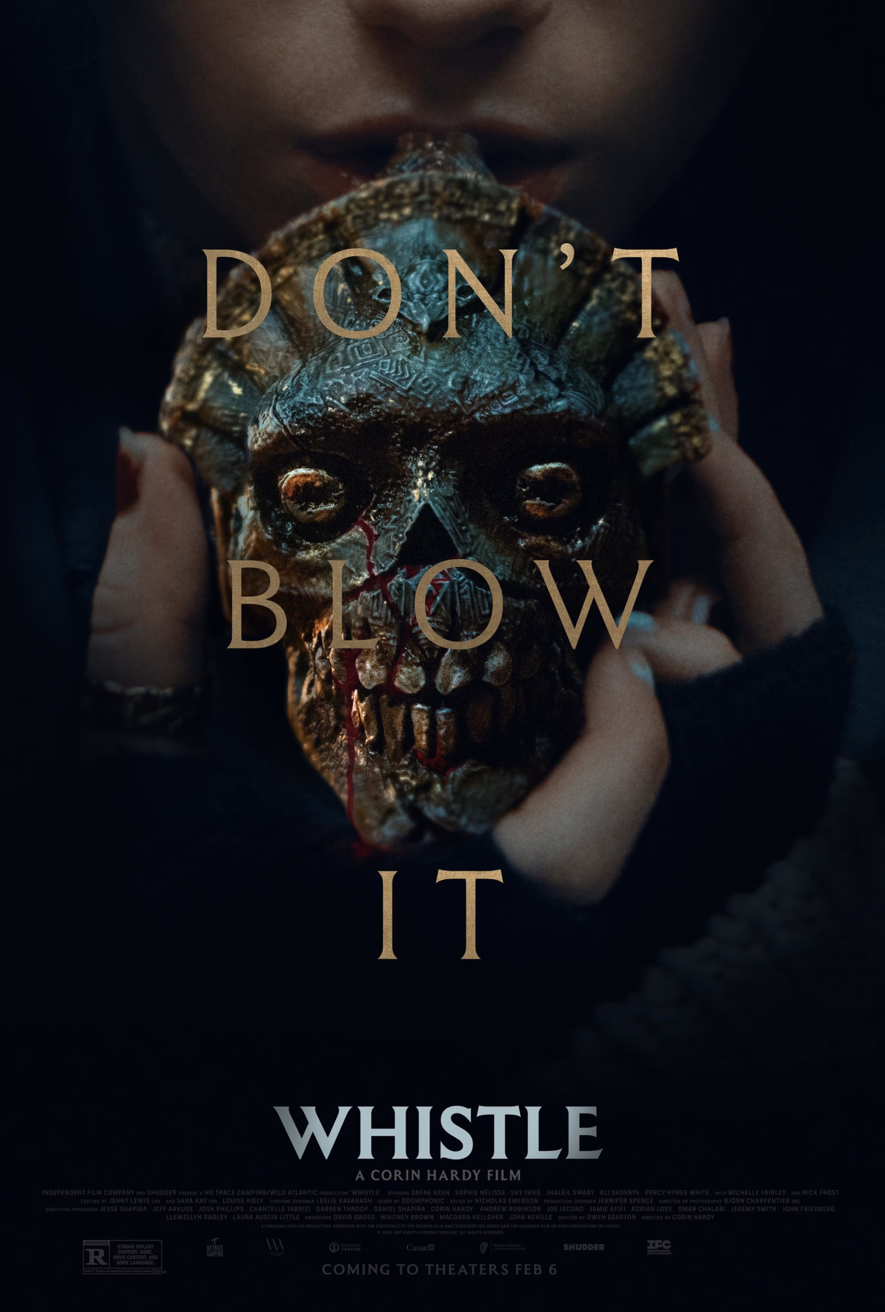 &lsquo;Whistle&rsquo; (2026) theatrical poster: the skull-shaped Ehecachichtli held toward the camera, gold tagline overlay.