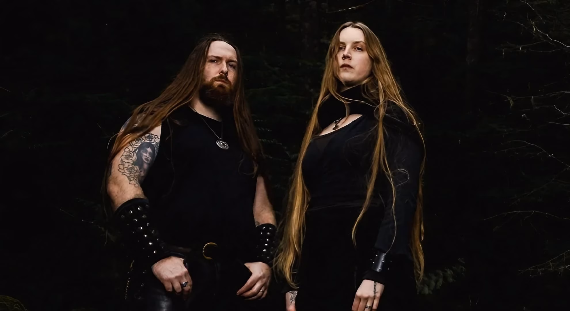 Hulder Turns Its Solo Ritual Into a Duet on ‘Verbolgen’ Necreon and Marz of Hulder stand side by side outdoors among trees.