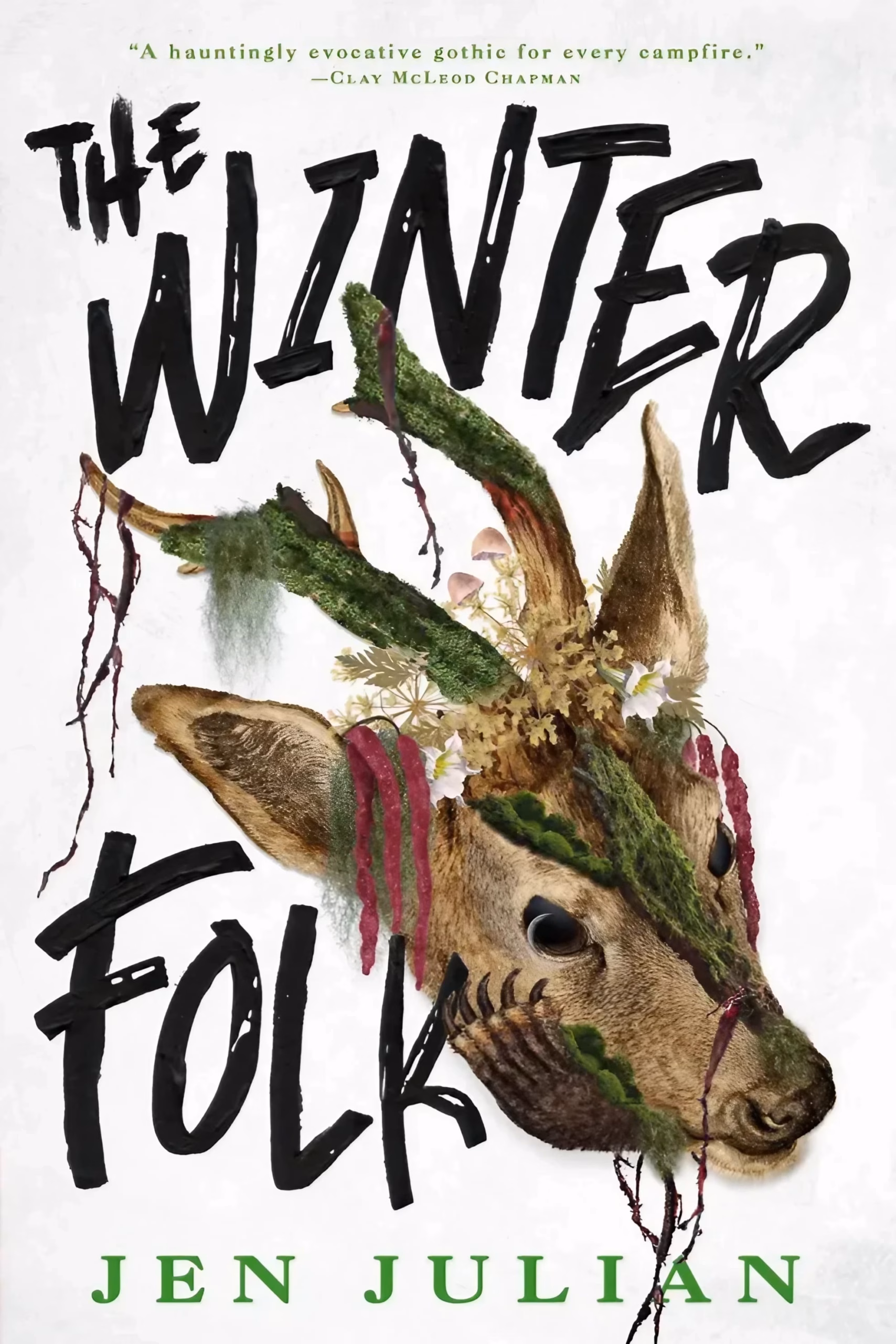‘The Winter Folk’ by Jen Julian, a moss-and-flower-covered deer head tilted beneath a hand-lettered brushstroke title.