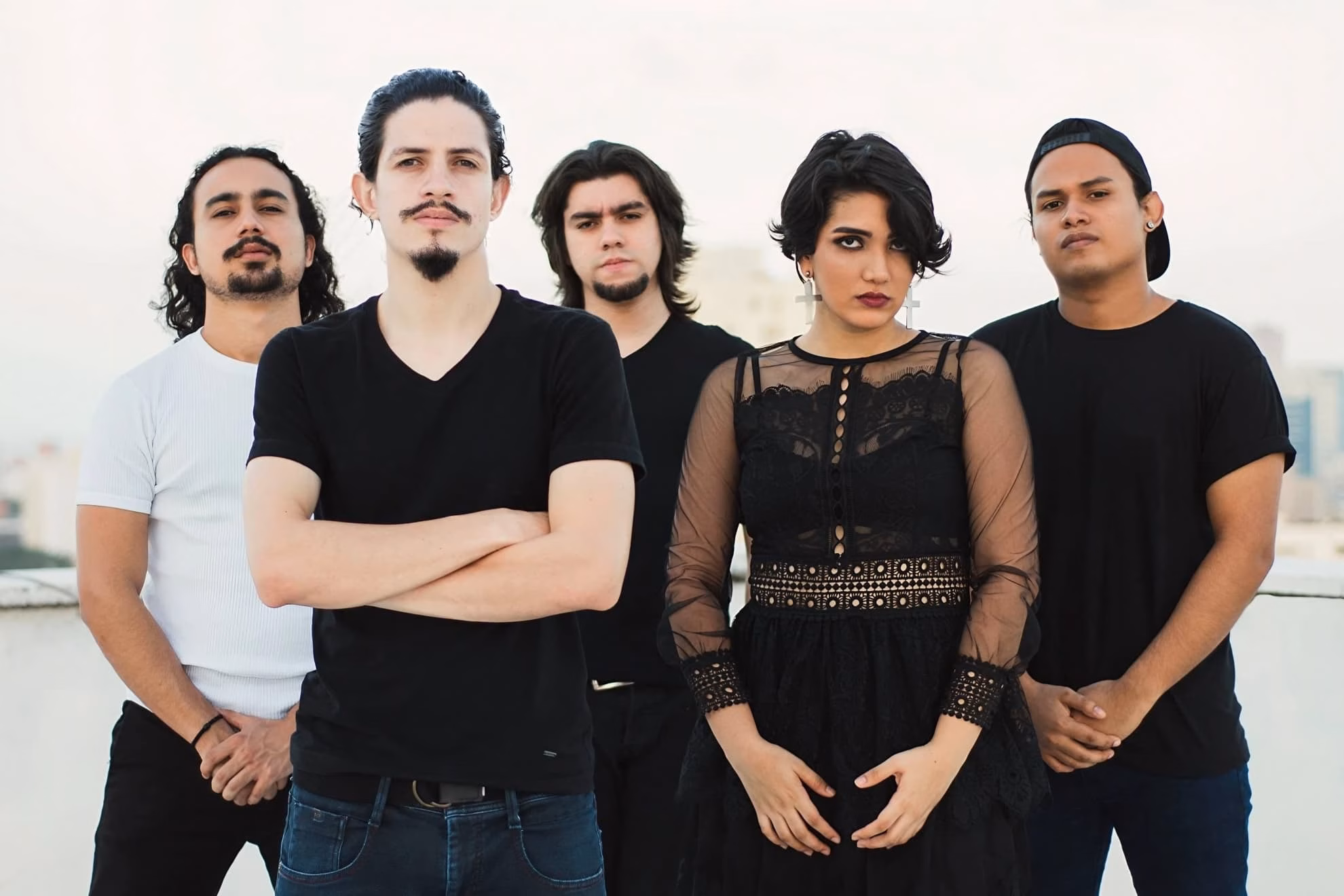 Septon’s five members in black clothing on a rooftop at dusk, city skyline behind.