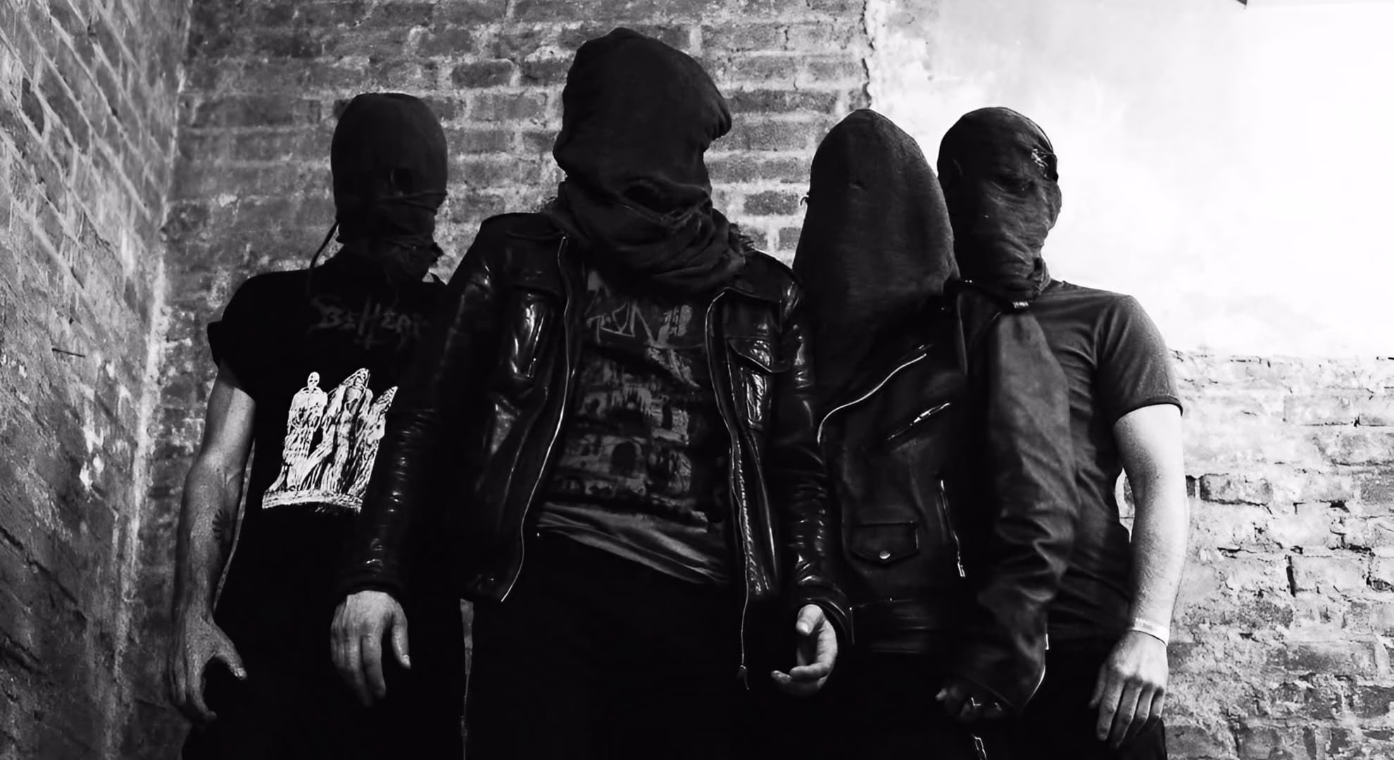 Viande Carve France’s War Dead Into ‘Monument aux Morts’ Viande’s four members, hooded and masked, in a 2023 black-and-white press photograph.