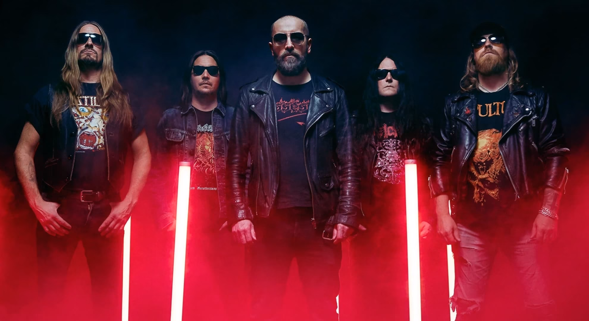 Five members of Bloodbath stand in leather jackets and sunglasses under red light.