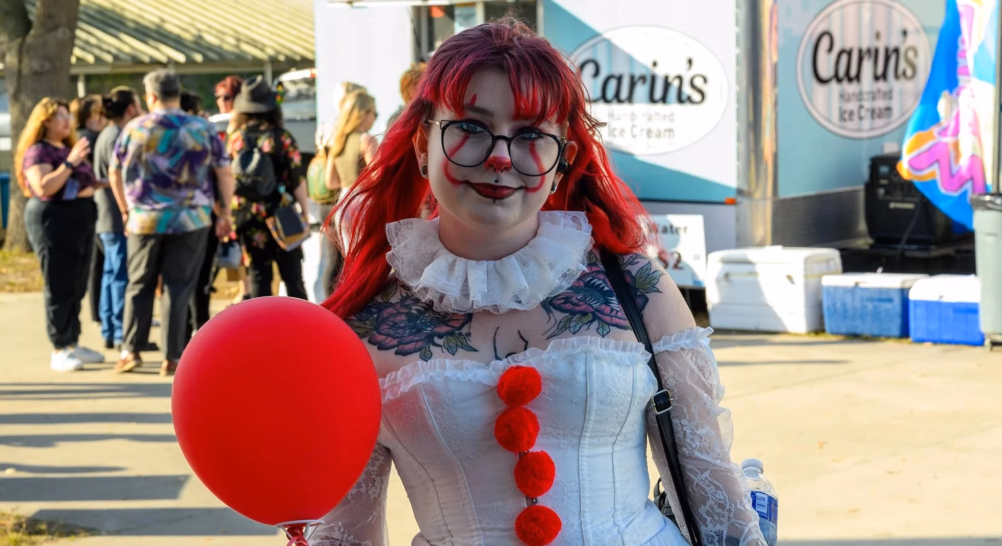 Grimoire Academy’s Gothic Market Returns to Escondido Costumed attendee holding a red balloon at a past stop on Grimoire Academy’s Gothic Market tour.