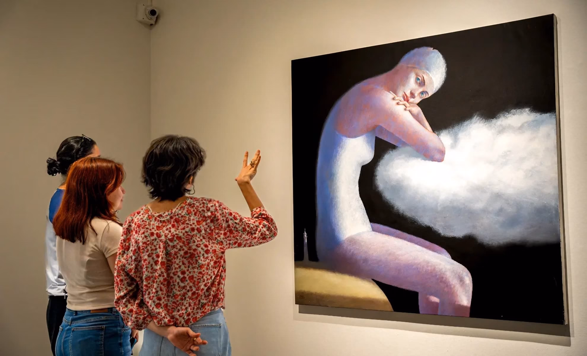 Visitors view a surrealist figure painting from Morales’s ‘J'avis sinistra’ at MAT, Ibagué.