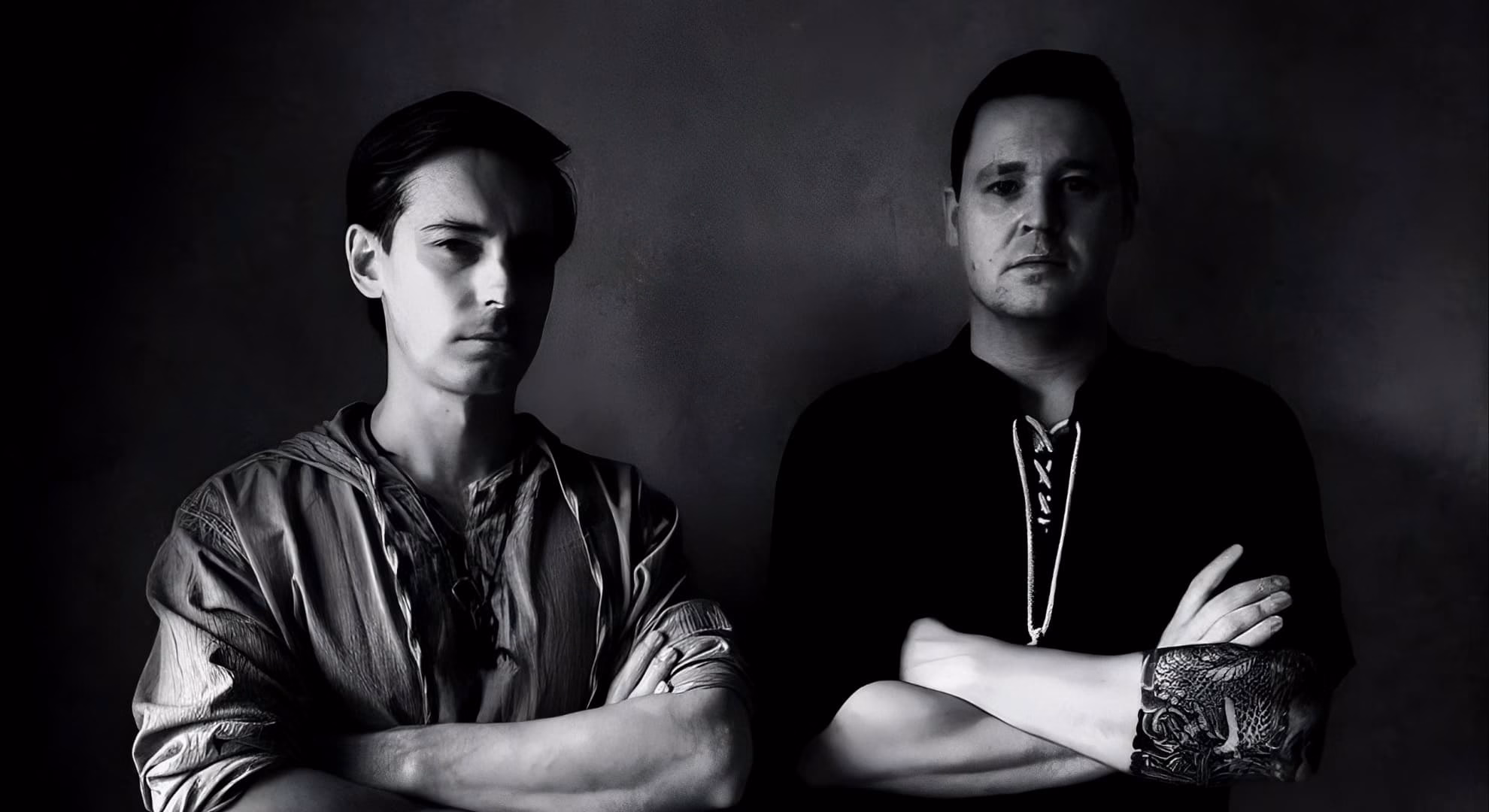 Jotungrav’s Matias Stenman and Teemu Leskinen in a black-and-white studio portrait.