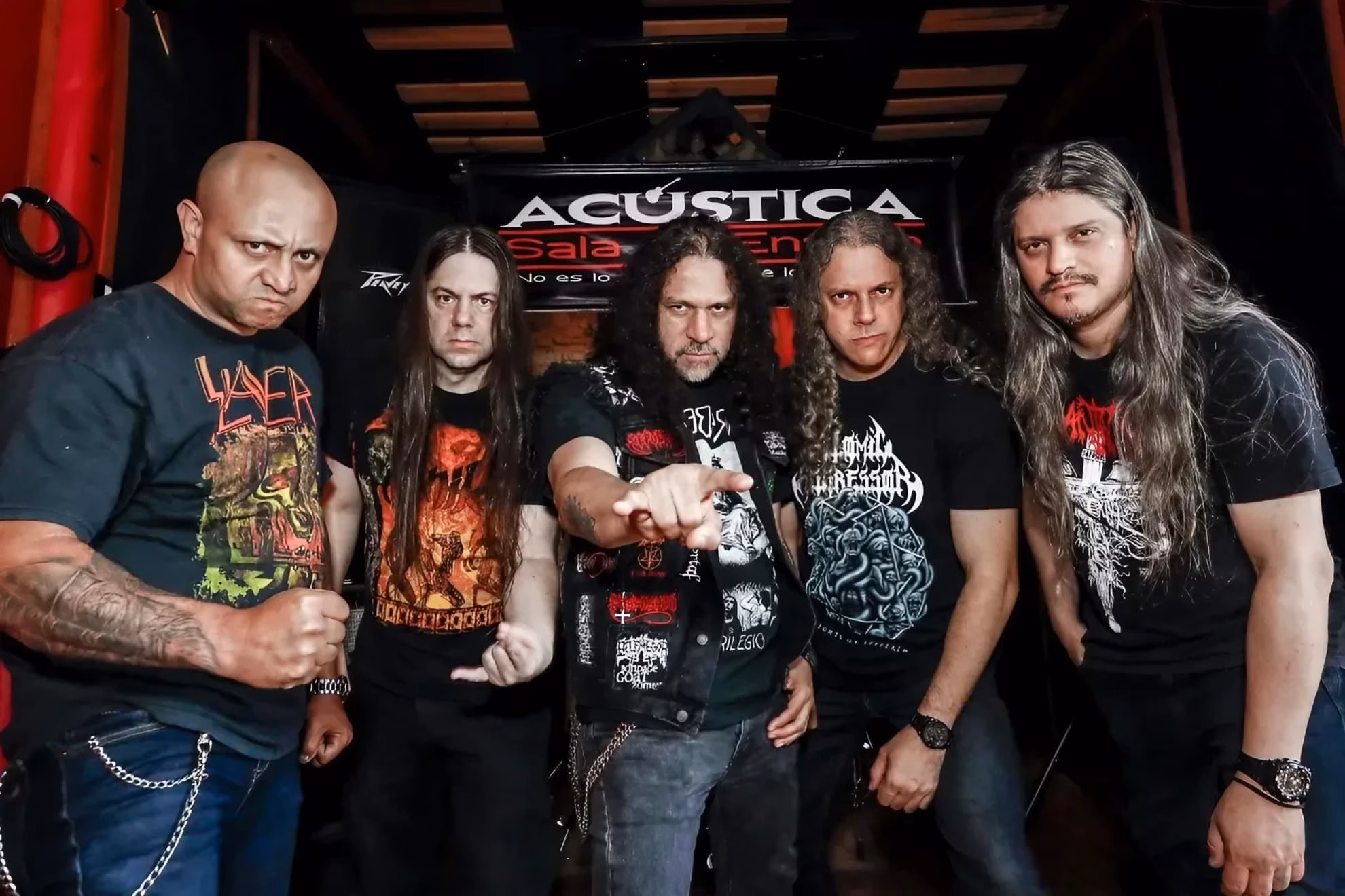 Five members of Masacre pose backstage at Acústica Sala de Ensayo in 2019.