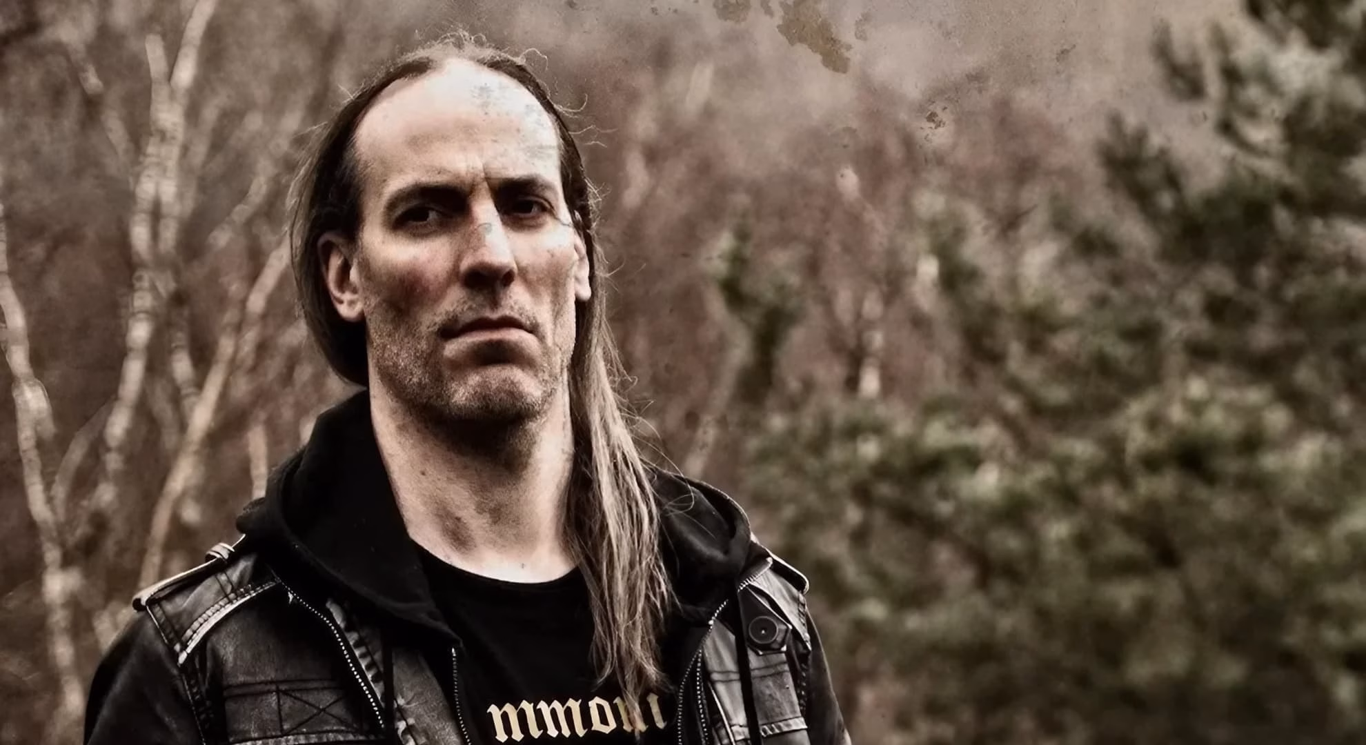 Naïwyn of Azgaal poses outdoors in a black leather jacket for a 2026 press photo.