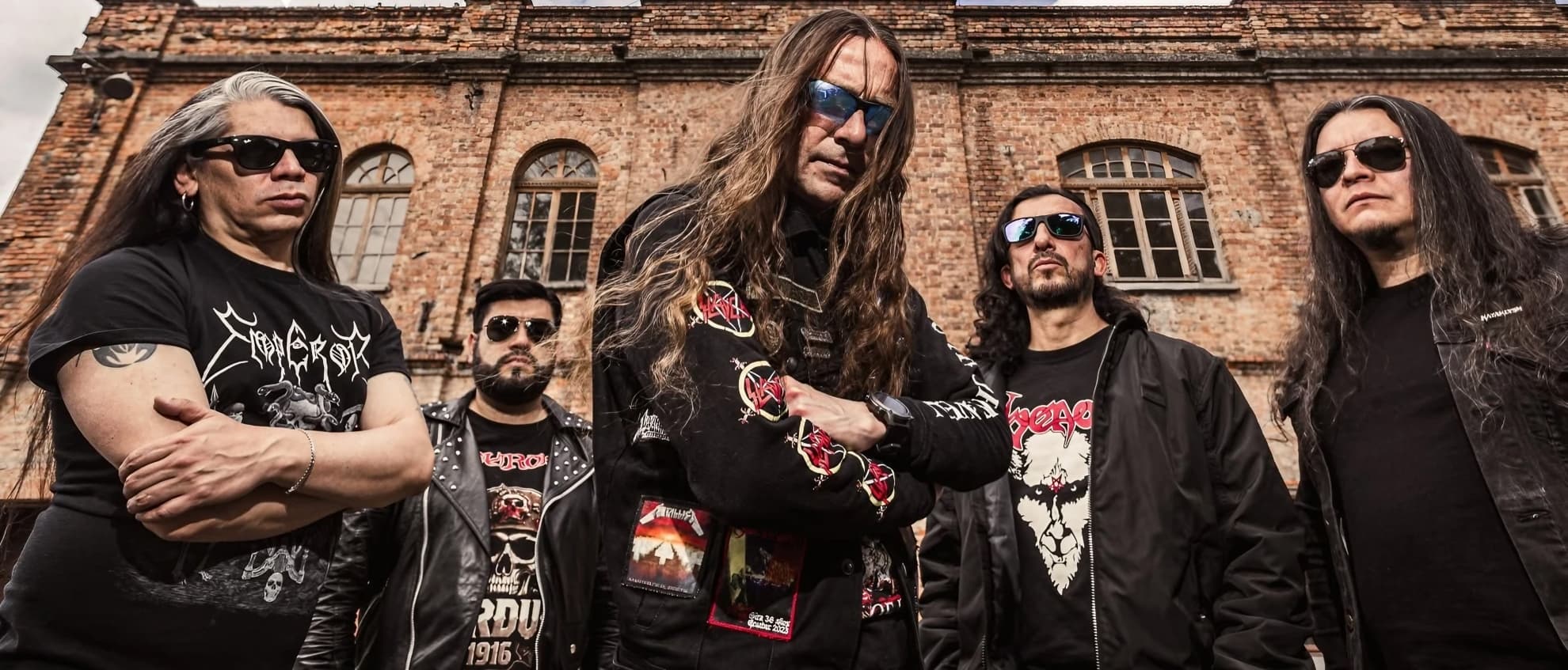 Neurosis Joins Bogothrash at Bogotá’s Ozzy Company Neurosis stand before an arched brick facade during the ‘Verdun 2025’ era.