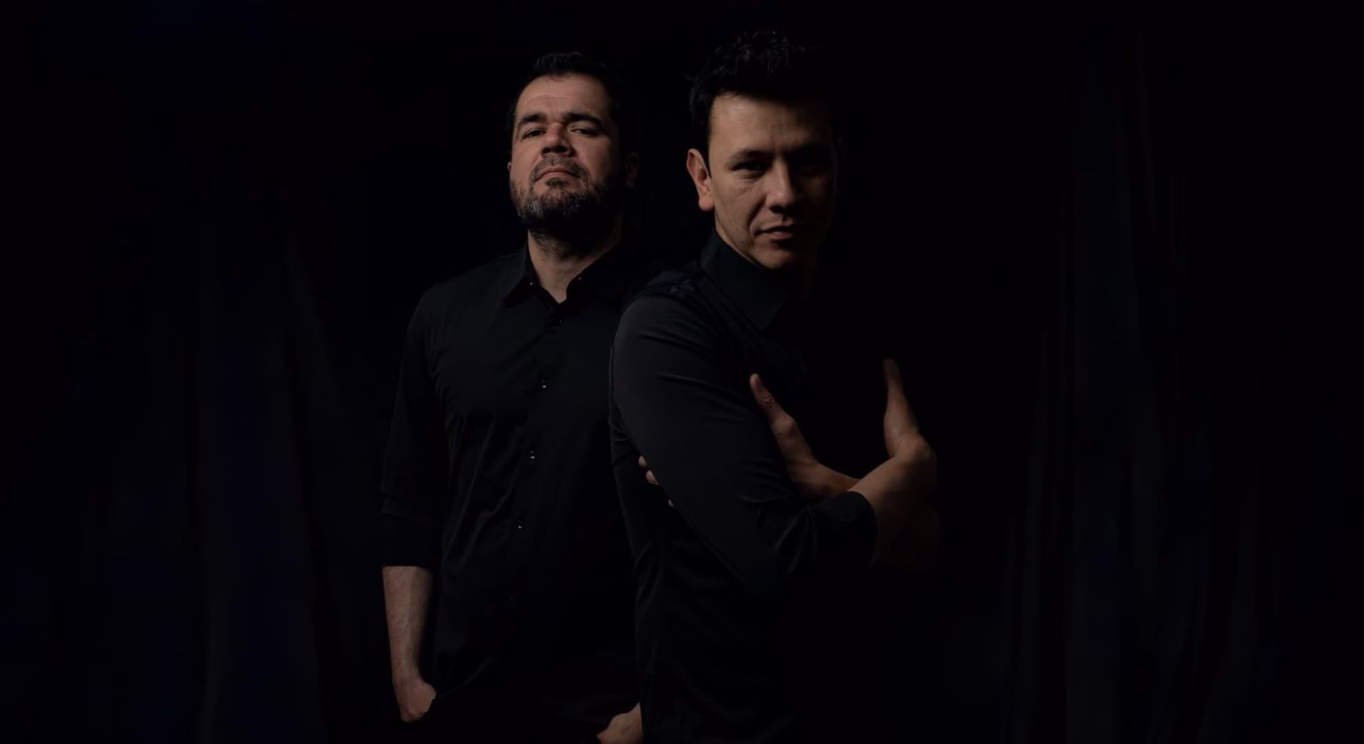 Self-Deceiver Exchanges the River Styx for ‘Nihil’ Self-Deceiver’s Jorge Oliveros and Sergio Chaparro in a dark press portrait, standing back to back.