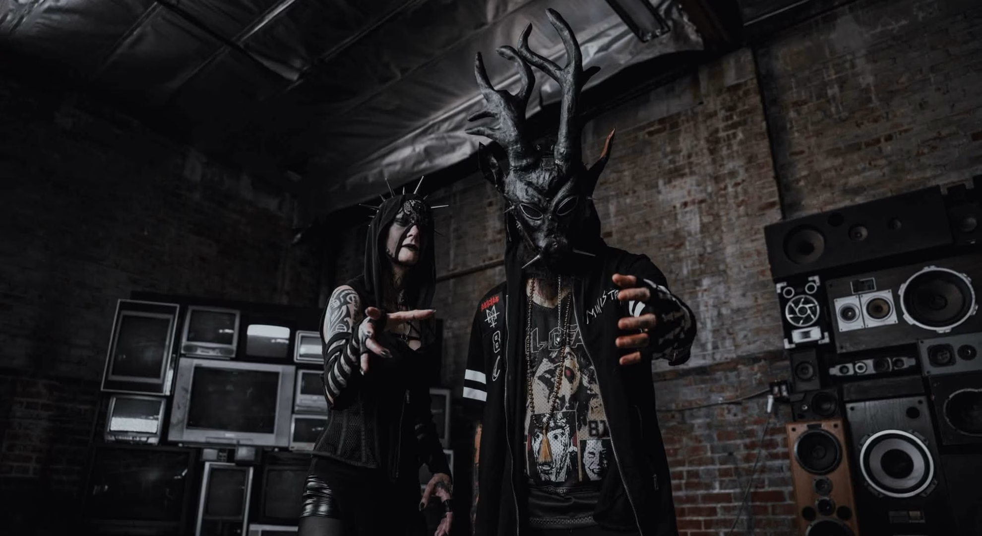 Antania Set Hecate’s Epithet to Machine Rhythm in ‘33’ Antania’s two members, one in an antlered mask, the other in a spiked hood, with arms outstretched.