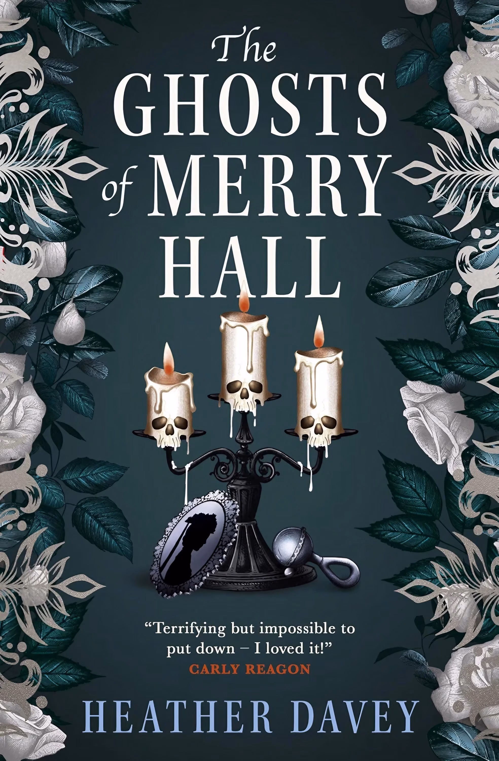 Heather Davey’s ‘The Memory Tree’ Roots Dread in a Yew Book cover of ‘The Ghosts of Merry Hall’ by Heather Davey. Framed by white roses and dark leaves, a black candelabra holds three lit skull-shaped candles dripping wax, resting above an oval silhouette portrait and a silver baby rattle.