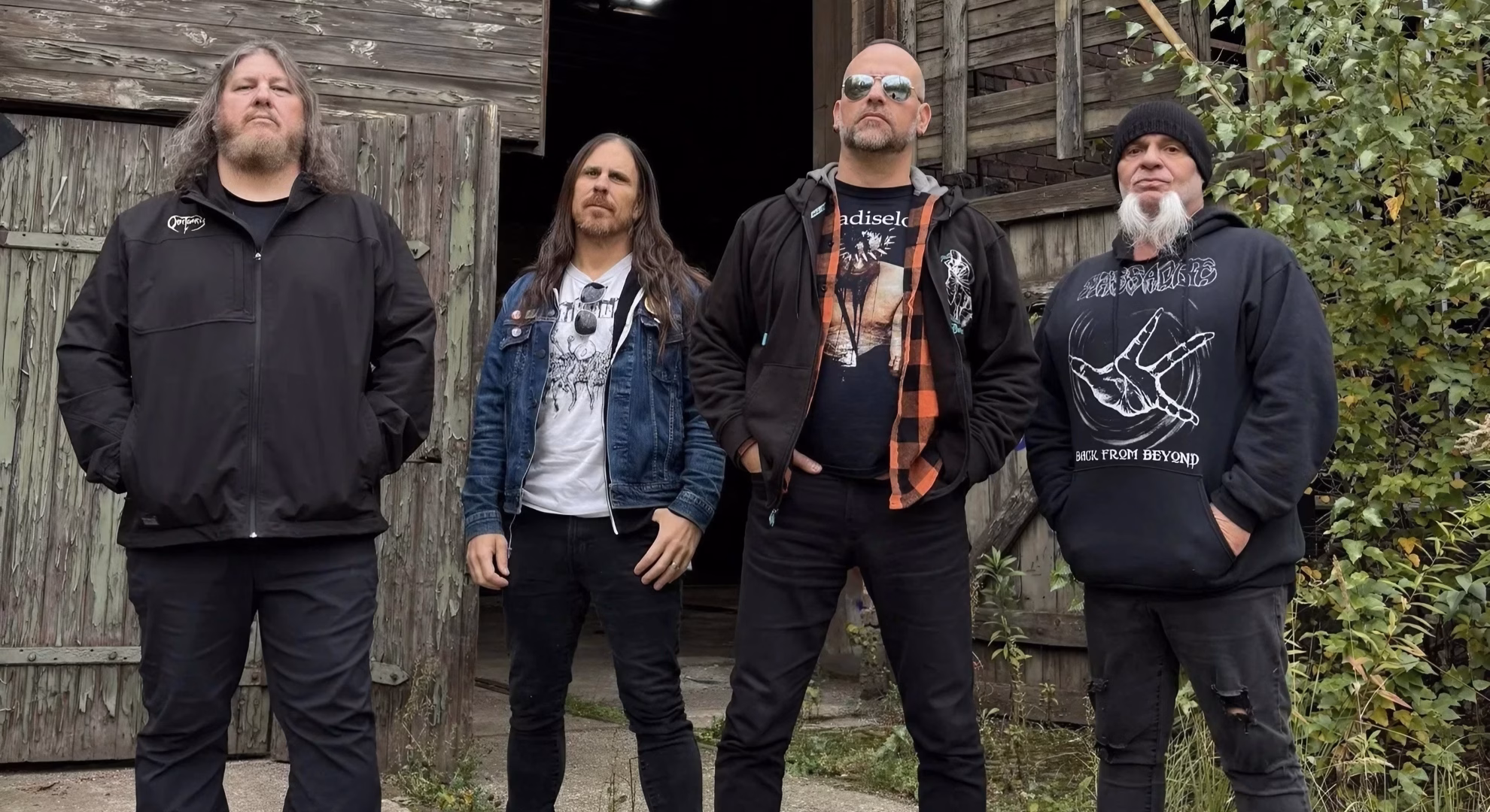 Left to Die Returns to Medellín’s Green Club in September Four members of Left to Die stand outside a weathered wooden barn.