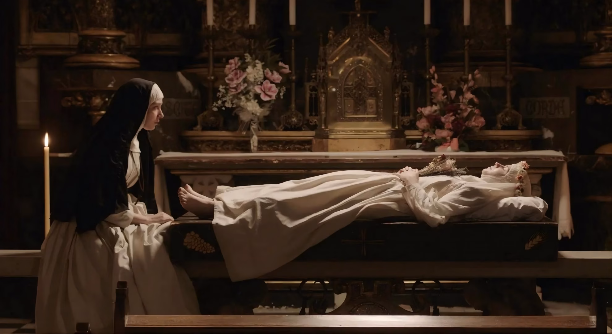 Pauline Brisy as Ana beside a novice’s funeral bier in ‘Upiro.’
